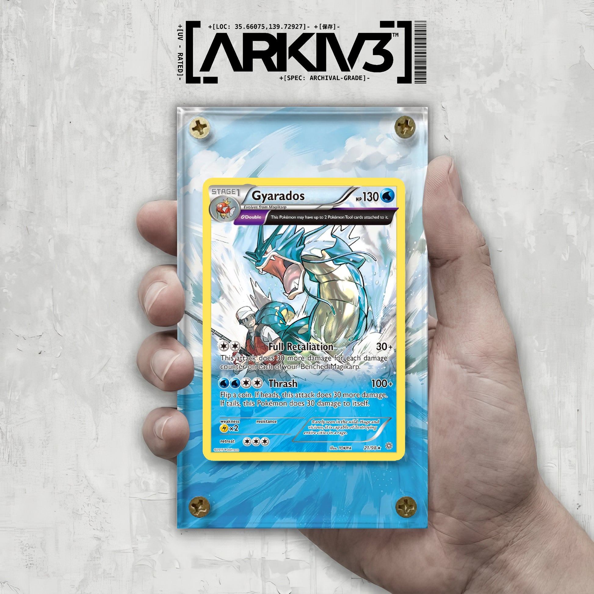 ARKIV3 Gyarados Extended Art Pokémon card display case with a hand holding the case, showcasing the collectible card.